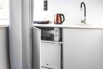 Фото номера Трехместный номер с кухней Гостиница Greenfeel Novgorod г. Великий Новгород 4