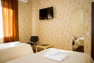 Фото номера Двухместный номер с 2 отдельными кроватями Гостевой дом Мини Отель Три Кота г. Великий Новгород 8
